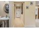 Main floor half bathroom with pedestal sink and decorative mirror at 5181 S Poplar Dr, Columbus, IN 47201