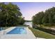Relaxing pool view overlooking the lake at sunset at 5181 S Poplar Dr, Columbus, IN 47201