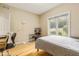 Cozy bedroom featuring a window, wood floors, and ample natural light at 5181 S Poplar Dr, Columbus, IN 47201