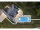 Aerial view of a rectangular pool and patio at night at 5181 S Poplar Dr, Columbus, IN 47201