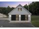 Detached two-car garage with modern black doors at 5181 S Poplar Dr, Columbus, IN 47201