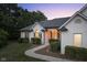 White brick home with arched entryway and manicured landscaping at 5181 S Poplar Dr, Columbus, IN 47201