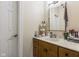 Well-lit bathroom with wood vanity and large mirror at 5181 S Poplar Dr, Columbus, IN 47201