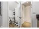 Small bathroom with toilet, shower, and linen closet at 5181 S Poplar Dr, Columbus, IN 47201