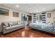 Spacious basement bedroom with comfortable bed and sitting area at 5181 S Poplar Dr, Columbus, IN 47201