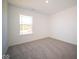 Bright bedroom with carpet, window, and ample space at 1402 Foxtail Ln, Greenwood, IN 46143