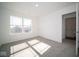 Well-lit bedroom featuring carpet and access to laundry at 1402 Foxtail Ln, Greenwood, IN 46143