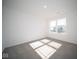 Spacious bedroom with carpeted floor and large window at 1402 Foxtail Ln, Greenwood, IN 46143