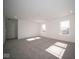 Spacious bedroom with neutral carpeting and window at 1402 Foxtail Ln, Greenwood, IN 46143