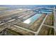 Aerial view of new homes and community amenities, including a lake and walking paths at 1402 Foxtail Ln, Greenwood, IN 46143