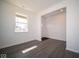 Spacious living room with vinyl plank flooring and large window at 1402 Foxtail Ln, Greenwood, IN 46143