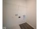 Bright laundry room with shelving and built-in storage at 1402 Foxtail Ln, Greenwood, IN 46143