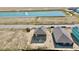 Aerial view of two new homes and a pond in a new community at 1402 Foxtail Ln, Greenwood, IN 46143