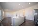 Open concept kitchen with island and stainless steel appliances at 1402 Foxtail Ln, Greenwood, IN 46143