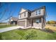 Two-story brick home with brown garage door and landscaped lawn at 1402 Foxtail Ln, Greenwood, IN 46143