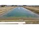 Community pond with fountain and walking path at 1402 Foxtail Ln, Greenwood, IN 46143