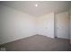 Spacious bedroom with neutral walls and carpet at 1402 Foxtail Ln, Greenwood, IN 46143