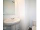 Small bathroom with pedestal sink and toilet at 1402 Foxtail Ln, Greenwood, IN 46143