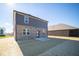 Rear view of house showing brick and siding at 1402 Foxtail Ln, Greenwood, IN 46143