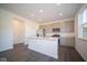 Spacious kitchen featuring an island and gray cabinets at 1402 Foxtail Ln, Greenwood, IN 46143