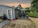 Charming patio area with gravel pathway, umbrella, and table at 5647 W Mooresville Rd, Indianapolis, IN 46221