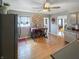 Kitchen with breakfast bar, stainless steel appliances and wood flooring at 5647 W Mooresville Rd, Indianapolis, IN 46221