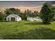 Large backyard with detached garage and shed at 5647 W Mooresville Rd, Indianapolis, IN 46221