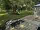 Large backyard with playset and pond feature at 5647 W Mooresville Rd, Indianapolis, IN 46221