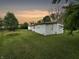 Ranch home with side yard and sunset view at 5647 W Mooresville Rd, Indianapolis, IN 46221