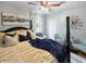 Bedroom with post bed, ceiling fan and two armchairs at 5647 W Mooresville Rd, Indianapolis, IN 46221