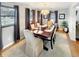 Elegant dining room with a wood table and six chairs at 5647 W Mooresville Rd, Indianapolis, IN 46221