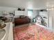 Finished basement with storage, seating area, and large rug at 5647 W Mooresville Rd, Indianapolis, IN 46221