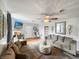 Open living room with two sofas, a fireplace, and a view to the dining area at 5647 W Mooresville Rd, Indianapolis, IN 46221