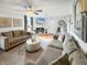 Bright living room featuring comfortable sofas and a charming fireplace at 5647 W Mooresville Rd, Indianapolis, IN 46221