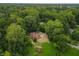 Aerial view of ranch house on wooded lot at 5806 Coburn Ave, Indianapolis, IN 46228