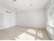 Bright bedroom with carpeted floor and large window at 4120 Ridgeway Ave, Columbus, IN 47203