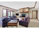 Cozy living area with fireplace and purple sofas at 9088 Nautical Watch Dr, Indianapolis, IN 46236