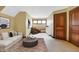 Comfortable bonus room with a couch, coffee table, and window seat at 9088 Nautical Watch Dr, Indianapolis, IN 46236