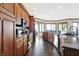 Modern kitchen with dark wood cabinets and granite countertops at 9088 Nautical Watch Dr, Indianapolis, IN 46236