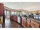 Spacious kitchen with granite countertops, dark wood cabinets, and stainless steel appliances at 9088 Nautical Watch Dr, Indianapolis, IN 46236