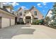 Brick house with three-car garage, and landscaped front yard at 9088 Nautical Watch Dr, Indianapolis, IN 46236