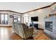 Relaxing Gathering room with a fireplace, hardwood floors, and large windows at 9088 Nautical Watch Dr, Indianapolis, IN 46236
