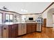 Large kitchen island with sink, dishwasher, and ample storage at 9088 Nautical Watch Dr, Indianapolis, IN 46236