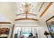Two-story entry with chandelier, balcony and view to living room at 9088 Nautical Watch Dr, Indianapolis, IN 46236