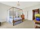 Charming bedroom with four-poster bed and lake view at 9088 Nautical Watch Dr, Indianapolis, IN 46236