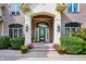 Elegant home entry with brick facade and lush landscaping at 9088 Nautical Watch Dr, Indianapolis, IN 46236
