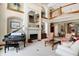 Elegant living room boasts a fireplace, high ceilings, and ample natural light at 9088 Nautical Watch Dr, Indianapolis, IN 46236