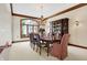 Elegant formal dining room featuring a large table, chandelier, and built-in hutch at 9088 Nautical Watch Dr, Indianapolis, IN 46236