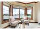 Bedroom sitting area with two armchairs and lake views at 9088 Nautical Watch Dr, Indianapolis, IN 46236