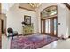Spacious entryway with a large rug, decorative furniture and a view to dining area at 9088 Nautical Watch Dr, Indianapolis, IN 46236